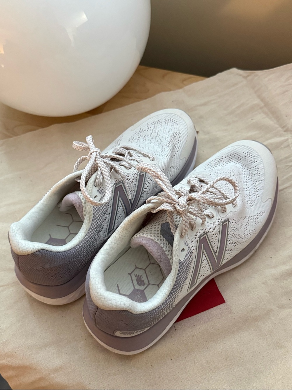 Pink and white New Balance runners